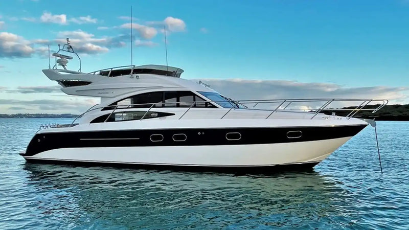 Luxury motor yacht anchored on calm waters, representing GPS tracking solutions for boats, tenders, fishing vessels, and charter operations in Australia.