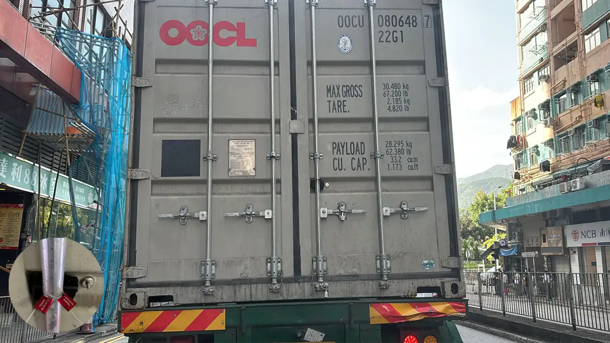 Rear view of a shipping container on a truck with a close-up of a security seal, representing GPS tracking solutions for monitoring container movements and cargo protection.