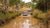 4WD vehicles driving through muddy water in a remote off-grid location, representing GPS fleet tracking solutions for construction, mining, and rugged environments."